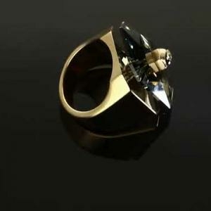 Swarovski Numina arany színű gyűrű nagy szürke kővel