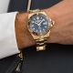 Roamer Premier barna fekete számlapos arany színű automata férfi óra 986983488520