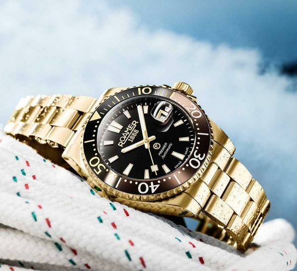 Roamer Premier barna fekete számlapos arany színű automata férfi óra 986983488520