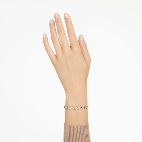 Swarovski Dextera arany színű karkötő vegyes metszésű fehér kristállyal 5667044