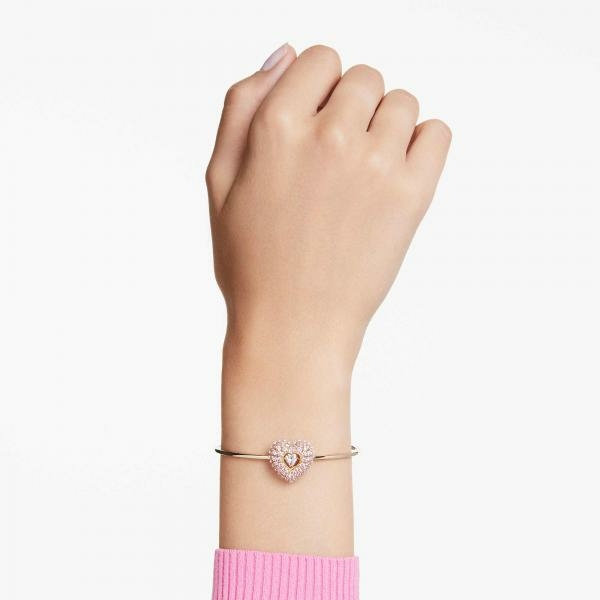 Swarovski Hyperbola arany színű karperec rózsaszín köves szív medállal 5687258