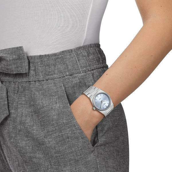 Tissot PRX quartz világos kék számlapos karóra T1372101135100