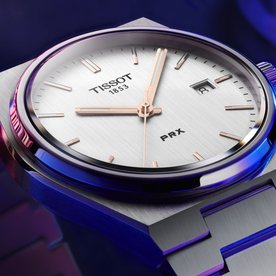 Tissot PRX quartz ezüst számlapos karóra T1374101103100
