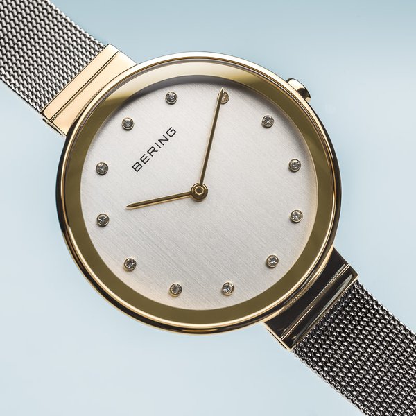 Bering Classic női óra arany tokkal kristállyal 12034-010