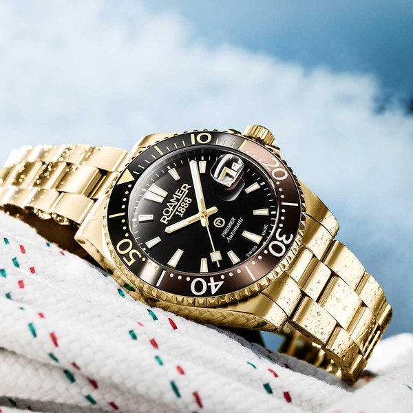 Roamer Premier barna fekete számlapos arany színű automata férfi óra 986983488520