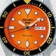 Seiko 5 Sports narancs fekete számlapos ezüst színű férfi óra SRPD59K1